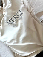 Sudadera con capucha "merci beaucoup”
