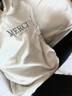 Sudadera con capucha "merci beaucoup”